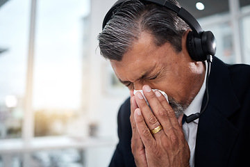 Image showing Sick, man and blowing nose in call center office for flu, allergies, and health risk in telemarketing agency. Face of mature salesman, CRM agent and tissue for virus, allergy bacteria and sneeze