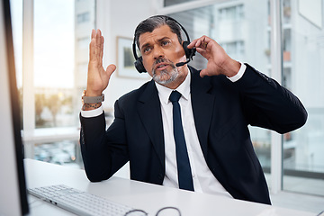 Image showing Talking, call center and mature man in customer service for communication or support. Conversation, contact and sales manager, telemarketing professional and crm consultant in discussion at help desk
