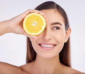 Image showing Beauty, studio face and happy woman with lemon for skincare glow, vitamin c detox and natural facial exfoliation. Fruit, organic cosmetics and person with citrus product benefits on white background