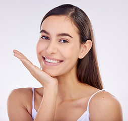 Image showing Face, skincare hand and beauty of woman with smile isolated on a white background in studio. Portrait, happy and natural model with cosmetics in spa facial treatment, aesthetic or wellness for health