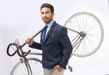 Image showing Business man, bicycle and studio portrait with retro suit, sustainable transport or pride by white background. Young entrepreneur, vintage fashion and bike for travel, transportation and eco friendly