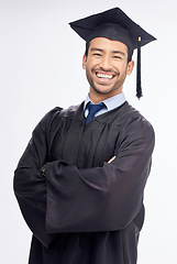 Image showing Student man, arms crossed and graduation in studio portrait, smile and success by white background. Young guy, happy university graduate and education achievement with pride, goals and celebration