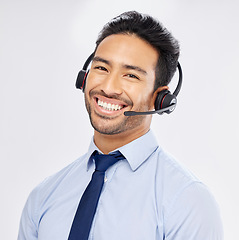 Image showing Face, call center and Asian man with headphones for telemarketing, crm support and isolated on a white studio background. Portrait, smile and sales agent, consultant or customer service professional