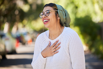 Image showing Hijab, muslim and woman in a park laughing feeling happy outdoor for religion on holiday or vacation for freedom. Happiness, smile and young Islamic person with joy, relax and a positive mindset