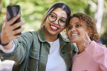 Image showing Women friends, selfie and peace sign at park with smile, hug or together for memory, blog or post on web. Girl, gen z students and happy for profile picture, photography or outdoor for social network