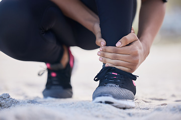 Image showing Fitness, ankle pain and running with woman on beach for sports injury, inflammation and accident. Emergency, healthcare and muscle with closeup of runner for exercise, physical therapy and workout