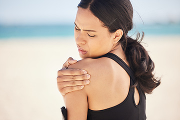 Image showing Fitness, shoulder pain and sports injury with woman on beach for running, inflammation and accident. Emergency, healthcare and mockup with female runner for exercise, physical therapy and workout