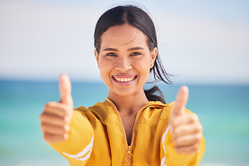 Image showing Happy woman, portrait and thumbs up on beach for approval, success or winning in motivation. Outdoor female person smile with like emoji, yes sign or OK for agreement in happiness on the ocean coast