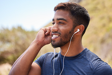 Image showing Fitness, happy man or runner with music in training, wellness or cardio exercise outdoors in nature. Headphones, radio audio or healthy athlete listening or streaming podcast to start running workout