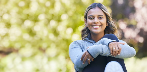 Image showing Happy, portrait and a woman outdoor at a park with happiness and a smile for wellness. Young female person in nature for a break or rest after workout, exercise or training with space for health