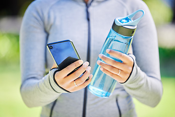 Image showing Fitness, health and phone with hands of woman in nature for running, tracker and social media. Marathon, communication and training with closeup of runner in park for app, online and technology