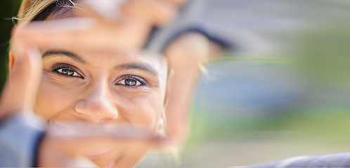 Image showing Nature, portrait and frame hands of a woman for photography, creativity and an outdoor fun. Smile, closeup and face of young girl or with a gesture for picture in a park for creative aesthetic