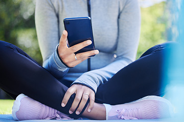 Image showing Yoga, phone and hands of woman in park for fitness app, social media and workout. Relax, technology and communication with closeup of female person and mobile in nature for search, exercise and peace