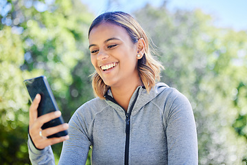 Image showing Phone, laughing and a happy woman outdoor at a park with internet connection and communication. Young female person with a smartphone for reading chat, email or social media meme outdoor in nature