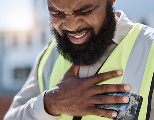 Image showing Stress, construction worker and a black man with a heart attack in the city. Healthcare, burnout and an African builder, architect or handyman with anxiety, chest pain or medical emergency on site