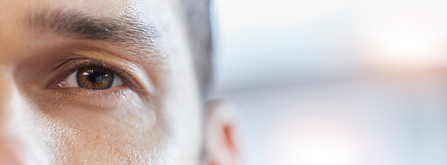 Image showing Closeup eye, portrait and a man with mockup for vision, healthcare and banner of contact lens. Focus, space and face of an optometry patient advertising health and wellness of eyesight with bokeh