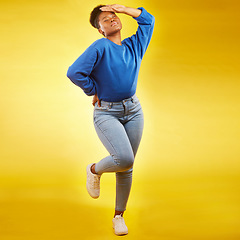 Image showing Fashion, faint and young black woman in casual jeans for style or clothing isolated in a studio yellow background. Sad, tired and African person with natural beauty, confident and posing with drama