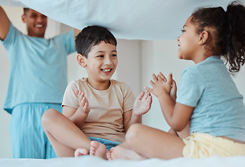 Image showing Children, play and family with blanket at bed, bonding or smile together to relax. Applause, kids game and father in bedroom with sheet for patty cake, happy and enjoying quality time in house