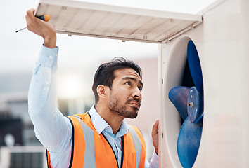 Image showing Engineer man, air conditioning and maintenance on roof, industry and inspection with thinking in city. Technician, hvac expert and check fan for air, safety and ac repair at construction site in cbd