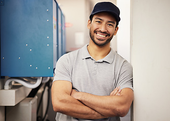 Image showing Engineer, happy portrait and a repair man at work for maintenance, service and inspection control. Male technician with arms crossed and a smile in a room for machine, engineering or power supply