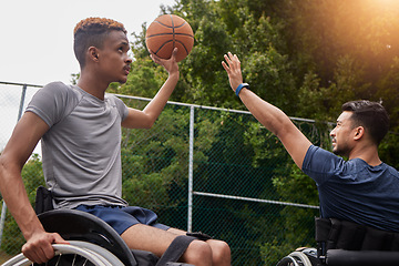 Image showing Sports, basketball goal and men in wheelchair for playing competition, challenge and practice outdoors. Fitness, wellness and male people with disability with ball for training, workout and exercise