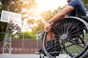 Image showing Sports, basketball court and man in wheelchair for goal in competition, challenge and practice outdoors. Fitness, wellness and male person with disability with ball for training, workout and exercise