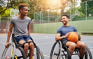 Image showing Basketball player, men and team in wheelchair for sports break, rest and fitness on training court. People with a disability, athletes and happy with ball, mobility equipment and exercise workout