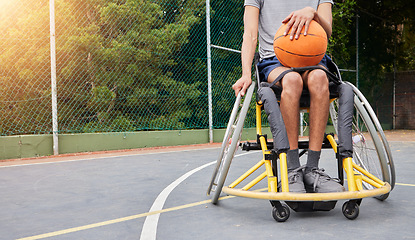 Image showing Sports, basketball and man in wheelchair with ball for playing game, challenge and practice outdoors. Fitness mockup, wellness and male person with disability for training, workout and exercise