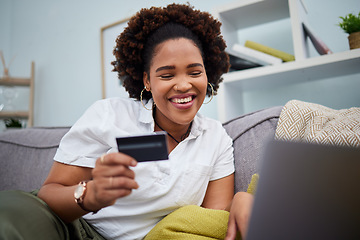 Image showing Happy black woman, laptop and credit card for online shopping, payment or banking on sofa at home. African female person or shopper smile with debit on computer app for ecommerce, purchase or buying