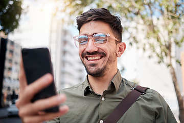 Image showing Phone, city and happy business man online for planning, social media and network in town. Travel, professional and face of male worker on smartphone for communication, website and search on commute