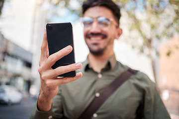 Image showing Phone, city and hand of business man online for chat, social media and network in town. Travel, professional and closeup of male worker on smartphone for communication, website and search on commute