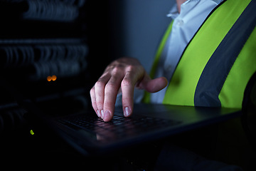 Image showing Engineering, night and hands of person on laptop for maintenance, repair and inspection in server room. Information technology, dark and IT technician on computer for analysis, data and control panel