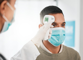 Image showing Laser, face mask or nurse with thermometer for healthcare checkup in hospital clinic or medical center. Hand, infrared temperature test or doctor screening for fever, virus or disease on patient