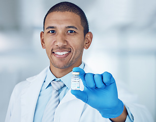 Image showing Portrait of man, doctor and vaccine bottle in hand for covid in hospital, safety and pharmaceutical drugs. Healthcare, medicine and medical professional with sample for corona vaccination in clinic.