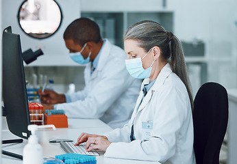 Image showing Woman, computer and face mask in science laboratory for medical virus research, medicine or vaccine development. Mature scientist, man or technology keyboard for healthcare or genetic disease control