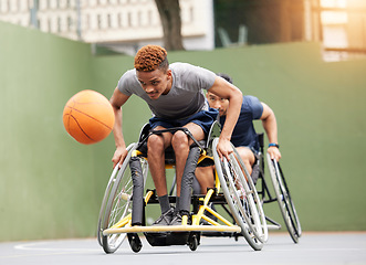 Image showing Sports, basketball game and men in wheelchair in action for training, exercise and workout on outdoor court. Fitness, team and male people with disability and ball for match, practice and games