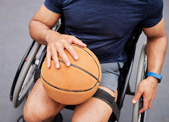 Image showing Wheelchair, basketball and man hand with sports ball outdoor for fitness, training and cardio. Exercise, hobby and top view of male with disability ready for game, workout and fun or active match