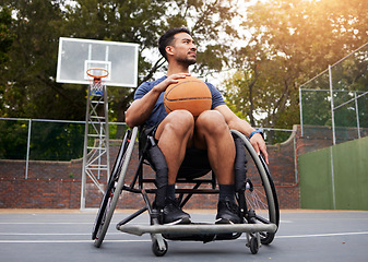 Image showing Sports, wheelchair and man with basketball at outdoor court for fitness, training and cardio. Exercise and person with a disability at a park for game, workout and resilience, challenge or mindset