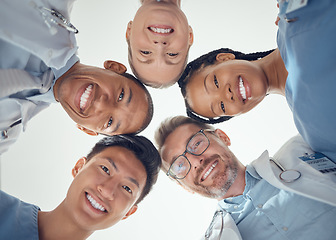 Image showing Portrait, teamwork or doctors in huddle with a happy smile collaboration for healthcare goals together. Diversity, success or low angle of medical nurses with group support, motivation or mission