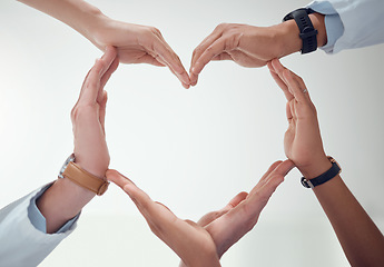 Image showing Heart, teamwork or hands of doctors with support in collaboration for healthcare wellness together. Closeup, love shape or medical nurses with group solidarity, integrity or mission with mockup space