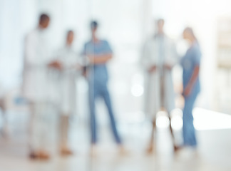 Image showing Group of doctors, nurses and blurred hospital, meeting and planning surgery or team schedule. Healthcare, discussion and medical staff in collaboration with feedback consultation together in clinic.