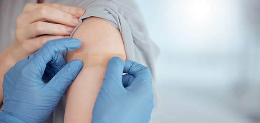 Image showing Doctor, arm and plaster on patient for vaccine in healthcare clinic, virus protection and wellness services. Closeup hands of nurse with medical bandage for safety, risk or immunity with mockup space