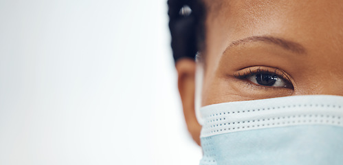 Image showing Doctor, portrait and black woman with mask, mockup banner and safety in healthcare on white background. Ppe, face and eyes of medical professional, hospital rules and compliance work in clinic space.