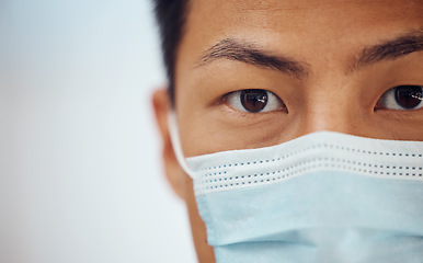 Image showing Doctor, portrait and Asian man with mask, mockup banner and safety in healthcare in hospital on white background. Ppe, face and eyes of medical professional, rules and compliance work in clinic space