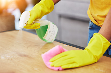 Image showing Table, spray and hands cleaning in a home for hygiene, germ protection and maintenance with a chemical in a house. Bacteria, service and housekeeper or cleaner working on a wood desk with gloves