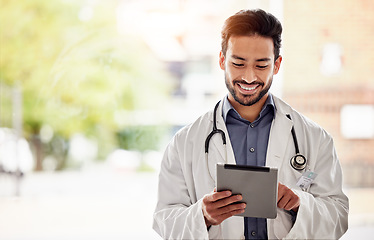 Image showing Asian man, doctor and tablet with smile in hospital for planning, research and consulting on blurred background. Clinic, schedule and Japanese male health expert on app for Telehealth, help or advice