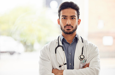 Image showing Serious, arms crossed and man doctor portrait in hospital with stethoscope, attitude and determined mindset. Proud, face and Japanese health expert worker in a clinic for help, advice and service