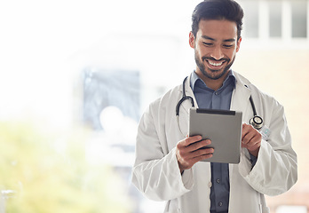 Image showing Doctor, asian man and tablet with smile in hospital for planning, research and consulting on blurred background. Clinic, schedule and Japanese male health expert on app for Telehealth, help or advice