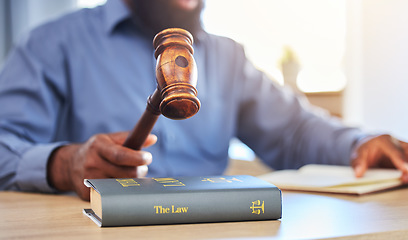 Image showing Hands, lawyer and gavel on books in office for attention, guide and justice in courtroom, law firm or truth. Closeup of hammer, legal knowledge and man for consulting attorney, judge and constitution