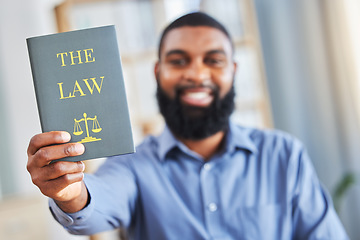 Image showing Law, book and happy portrait of a man with the rules or research on legal constitution, regulation or policy from government. African businessman, lawyer or attorney with knowledge of justice